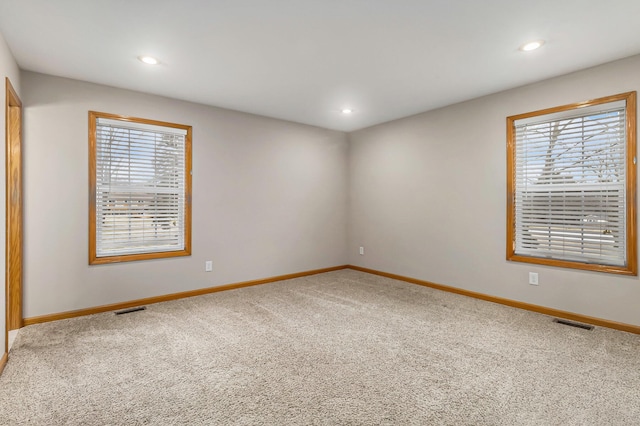 empty room featuring carpet flooring