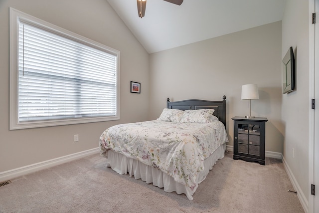 carpeted bedroom featuring ceiling fan and vaulted ceiling