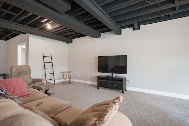 living room featuring beamed ceiling and carpet