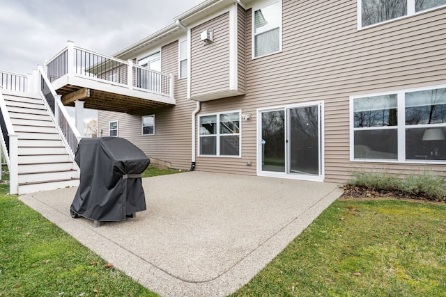 rear view of property with a patio and a lawn