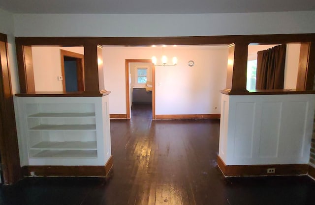 unfurnished room with dark wood-type flooring