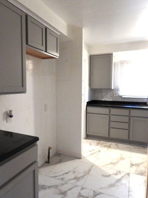 kitchen with gray cabinets and sink