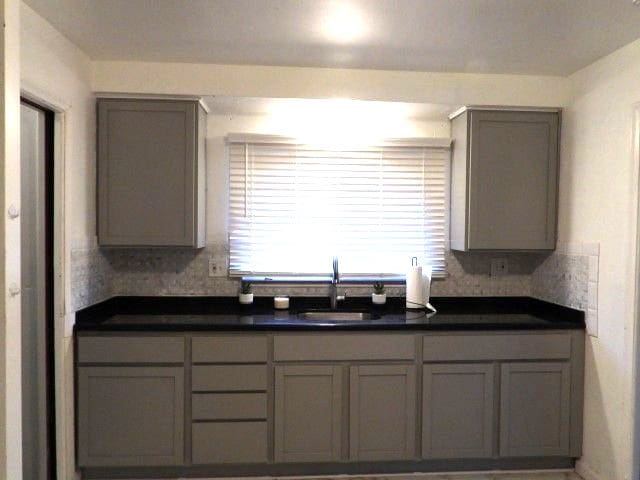 kitchen with sink and gray cabinetry