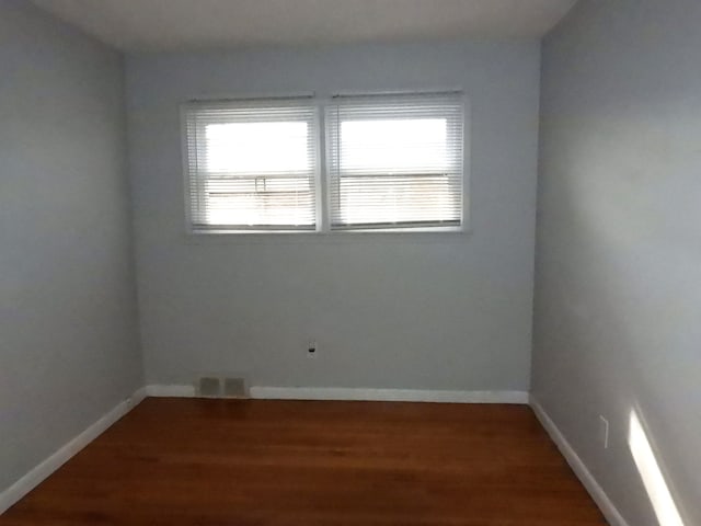 empty room featuring hardwood / wood-style flooring