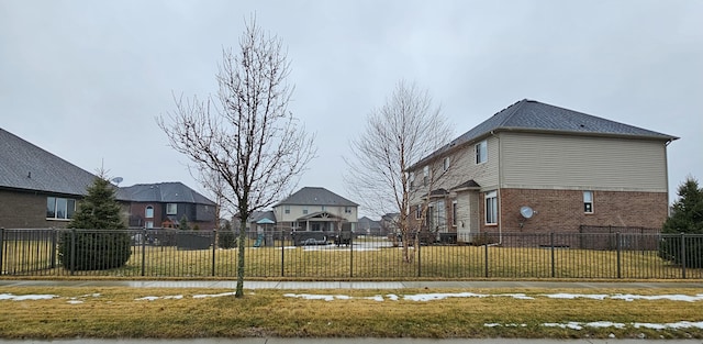 view of side of property with a yard