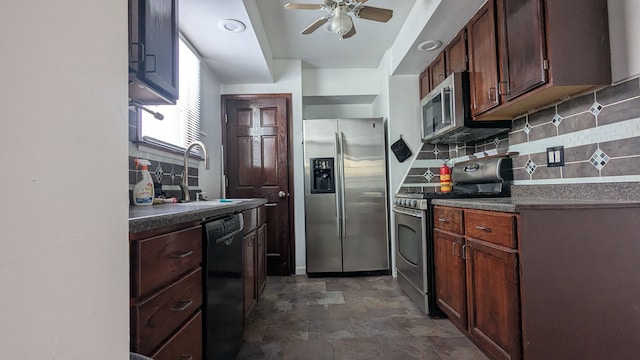 kitchen with tasteful backsplash, ceiling fan, appliances with stainless steel finishes, and sink