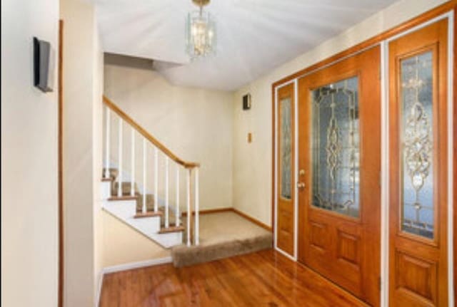 foyer entrance featuring hardwood / wood-style flooring