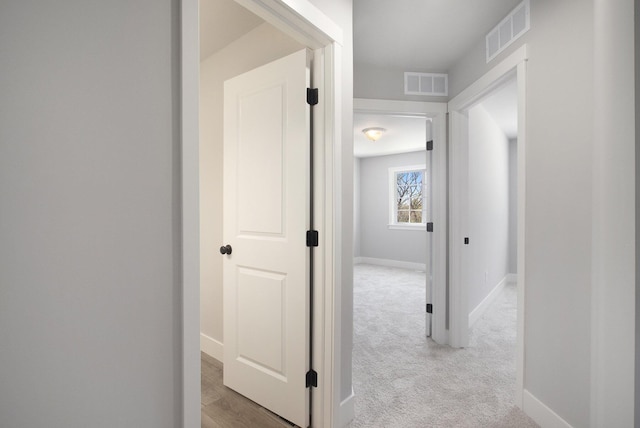 304 Ash St, South Haven, MI 49090 - hall featuring baseboards, visible vents, and carpet