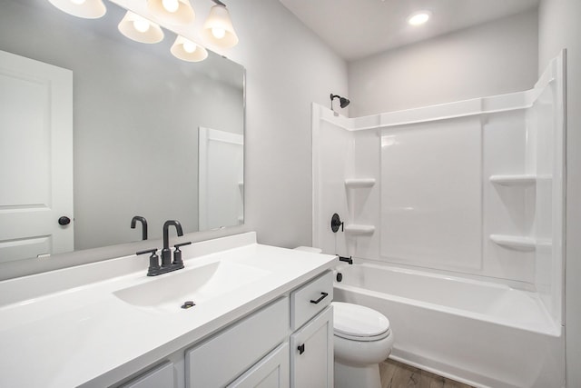304 Ash St, South Haven, MI 49090 - bathroom featuring bathtub / shower combination, wood finished floors, toilet, and vanity