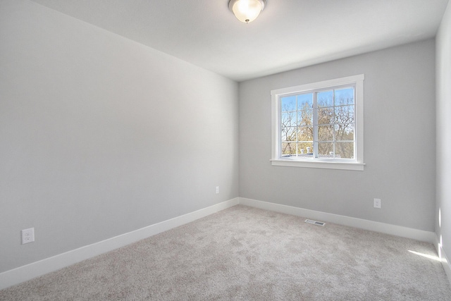 304 Ash St, South Haven, MI 49090 - unfurnished room with visible vents, baseboards, and light carpet