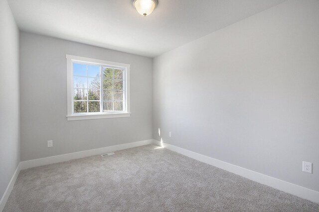 304 Ash St, South Haven, MI 49090 - carpeted spare room with visible vents and baseboards