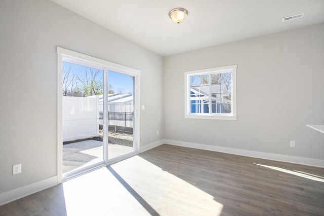 304 Ash St, South Haven, MI 49090 - unfurnished room with visible vents, wood finished floors, and plenty of natural light