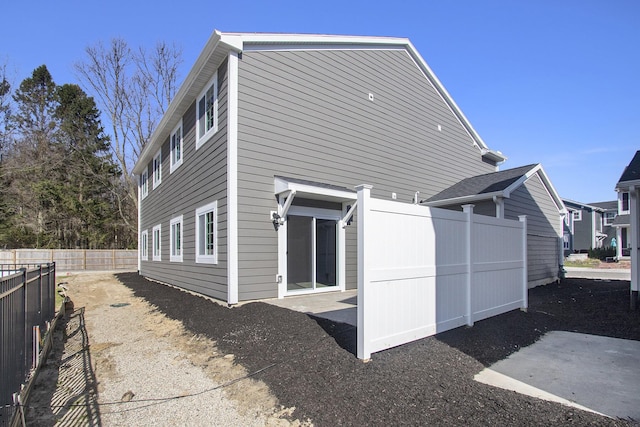 304 Ash St, South Haven, MI 49090 - back of house with fence and a patio area