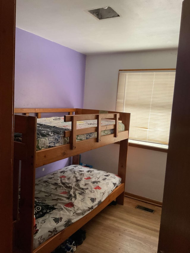 bedroom with light hardwood / wood-style flooring