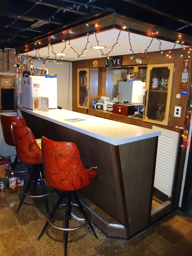 bar featuring fridge