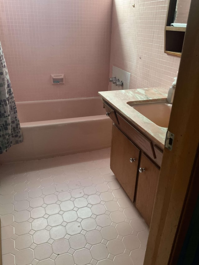 bathroom featuring shower / tub combo with curtain, vanity, and tile patterned flooring