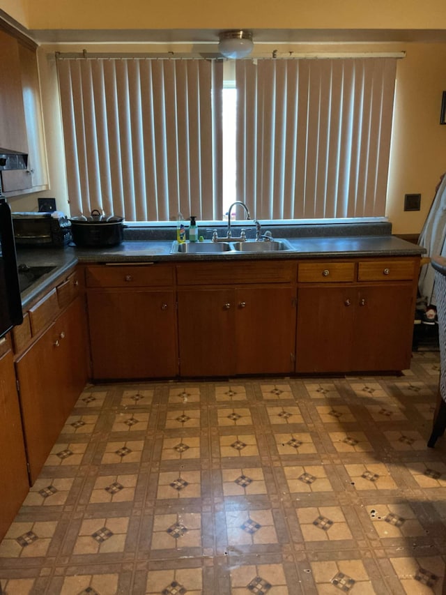 kitchen with black electric cooktop and sink