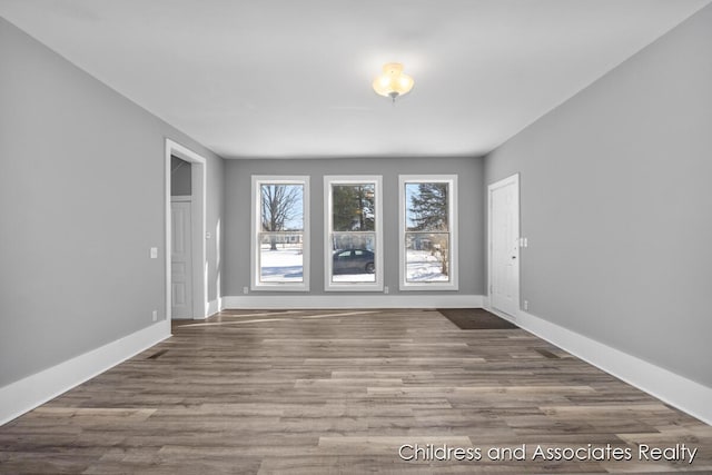 spare room featuring hardwood / wood-style flooring