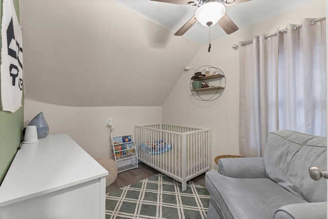 bedroom featuring lofted ceiling, dark wood-type flooring, and ceiling fan