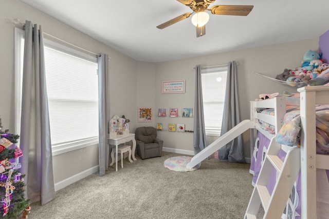 carpeted bedroom featuring ceiling fan