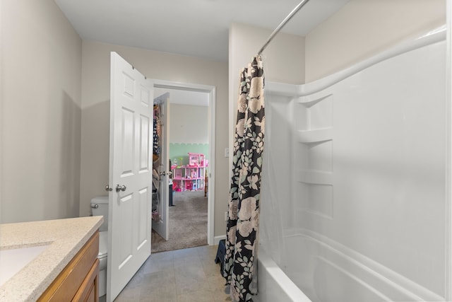 full bathroom featuring tile patterned floors, vanity, toilet, and shower / bath combo