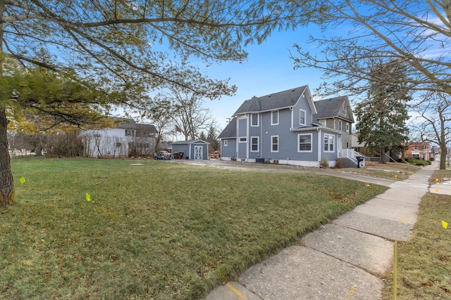 view of home's exterior featuring a shed and a yard