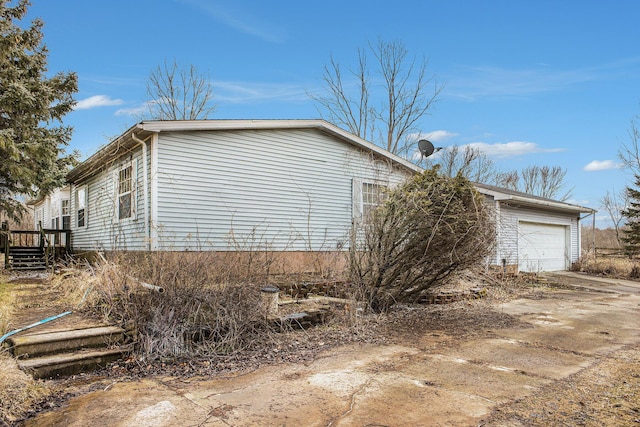 view of property exterior featuring a garage