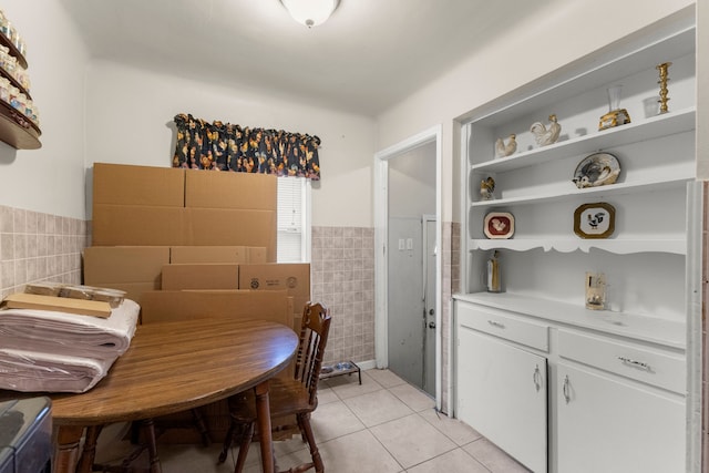 dining area with tile walls and light tile patterned floors