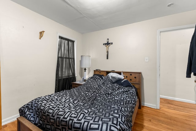 bedroom with hardwood / wood-style floors