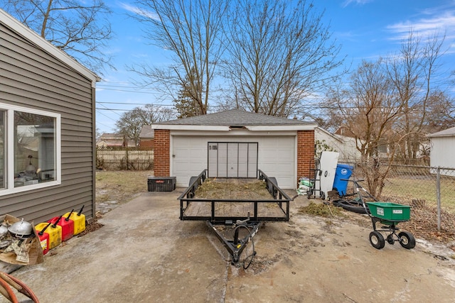 view of patio with an outbuilding and a garage