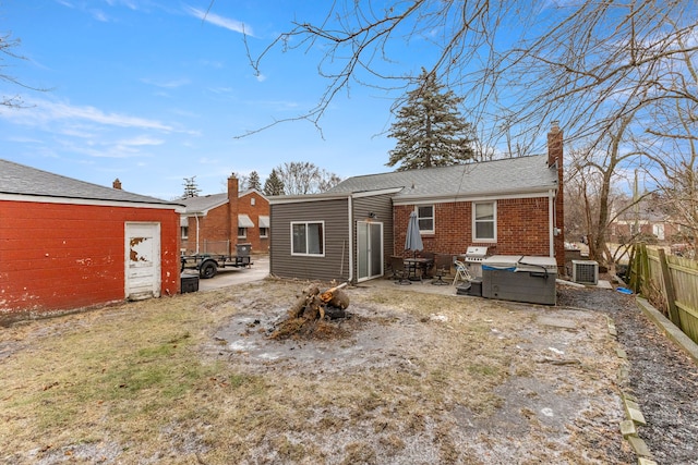 back of house featuring central AC unit and a patio area