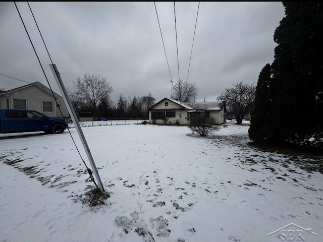 view of yard layered in snow