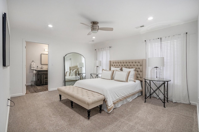 bedroom featuring carpet, connected bathroom, and ceiling fan