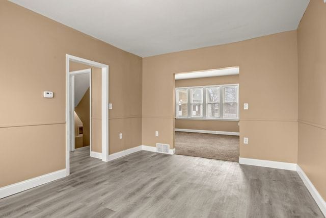 unfurnished room featuring light hardwood / wood-style floors