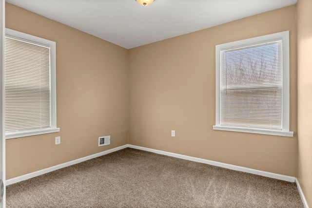 unfurnished room with carpet floors