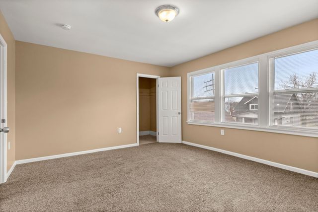 unfurnished bedroom featuring a closet and carpet