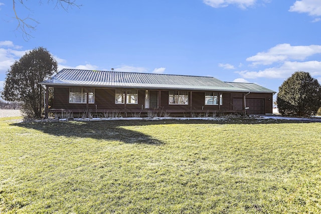 view of front of property with a garage and a front yard