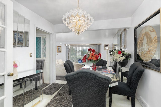 dining space with a chandelier