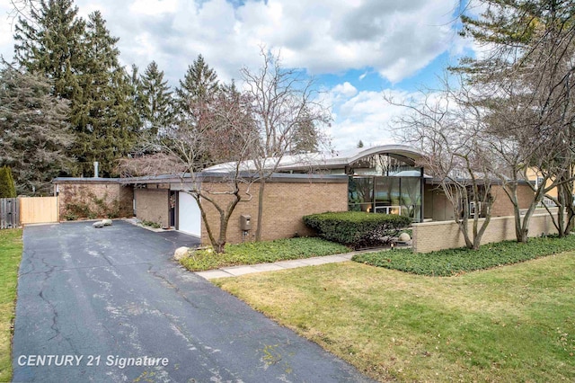 view of property exterior with a lawn