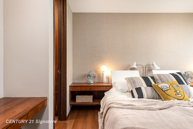 bedroom with wood-type flooring