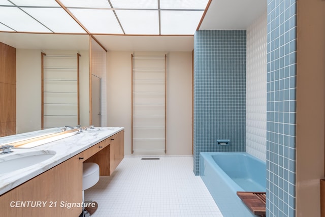 bathroom with vanity and tile patterned floors