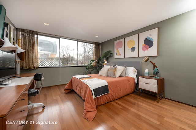 bedroom with light hardwood / wood-style flooring