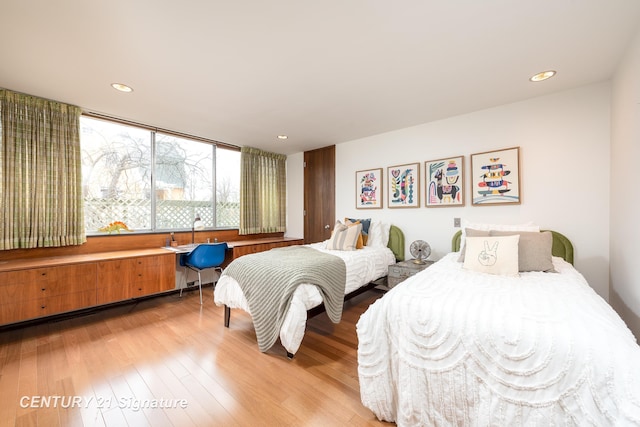 bedroom with wood-type flooring