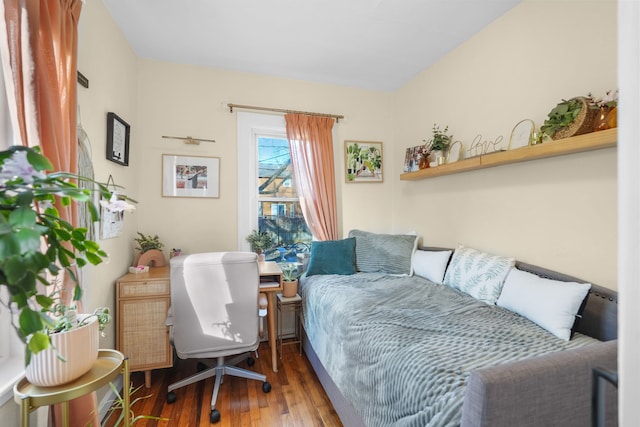 bedroom with hardwood / wood-style flooring