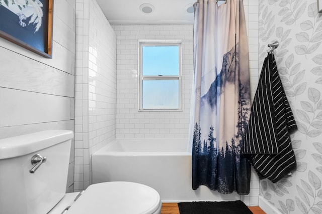 bathroom with shower / tub combo and toilet