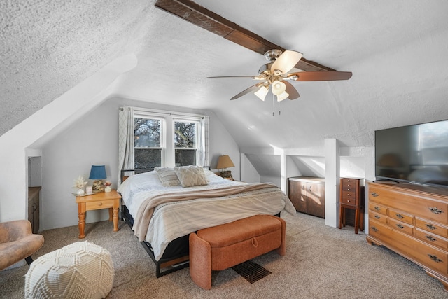 bedroom with lofted ceiling, ceiling fan, light carpet, and a textured ceiling