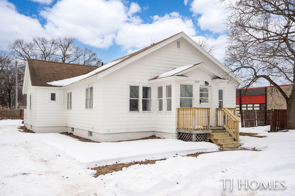 view of snow covered house