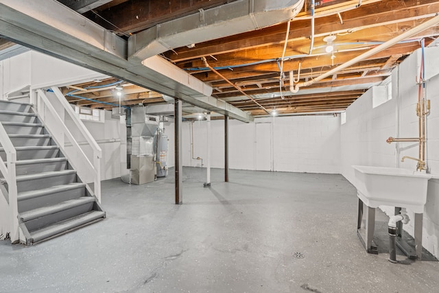 basement featuring heating unit and gas water heater