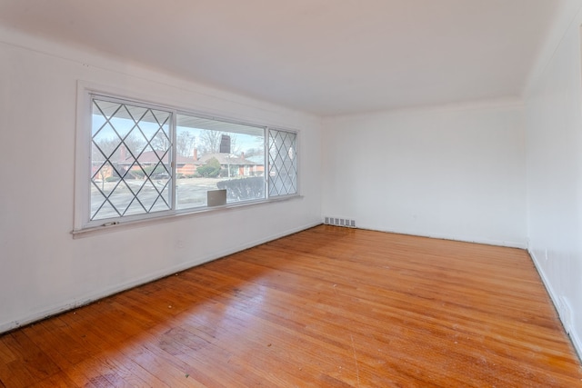 unfurnished room with light hardwood / wood-style flooring