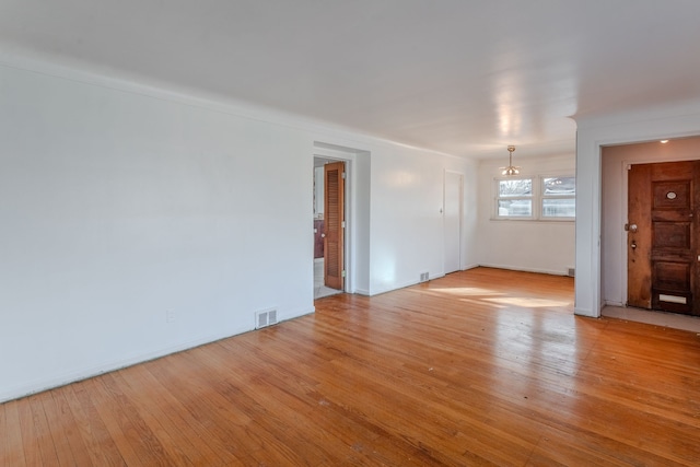 unfurnished room featuring light hardwood / wood-style floors